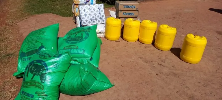 Food supply sacks and yellow containers prepared for the feeding program