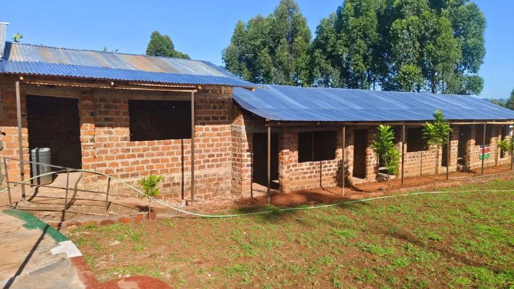 A classroom building with a corrugated roof at Restoration